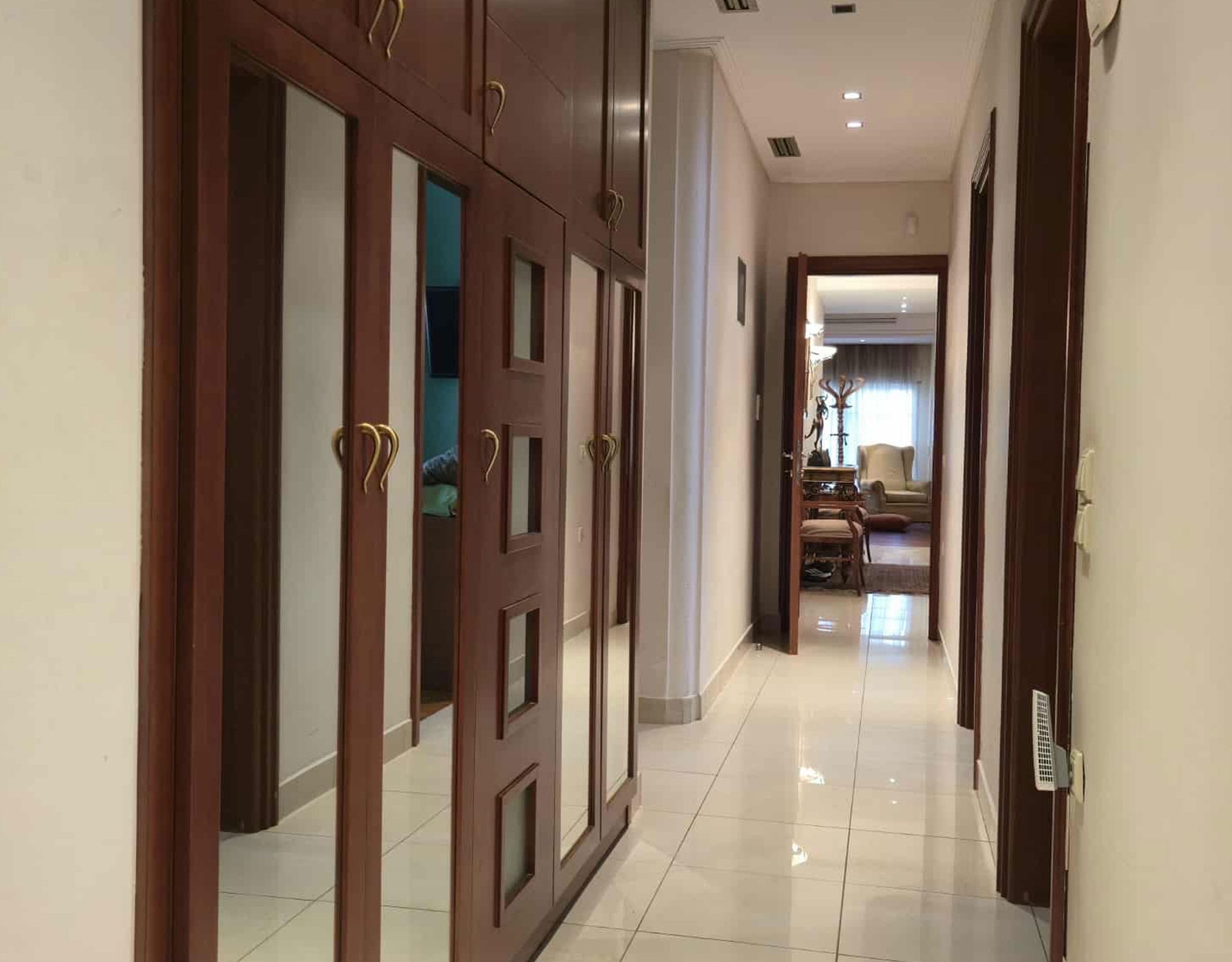 Interior hallway with built-in wardrobes and glossy floor finish, Oreokastro, Thessaloniki, Greece