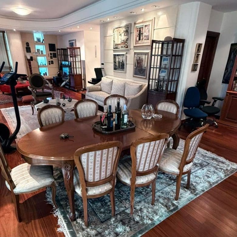 Open-plan living and dining area with wood flooring, dining table, and classic furnishings, Oreokastro, Thessaloniki, Greece