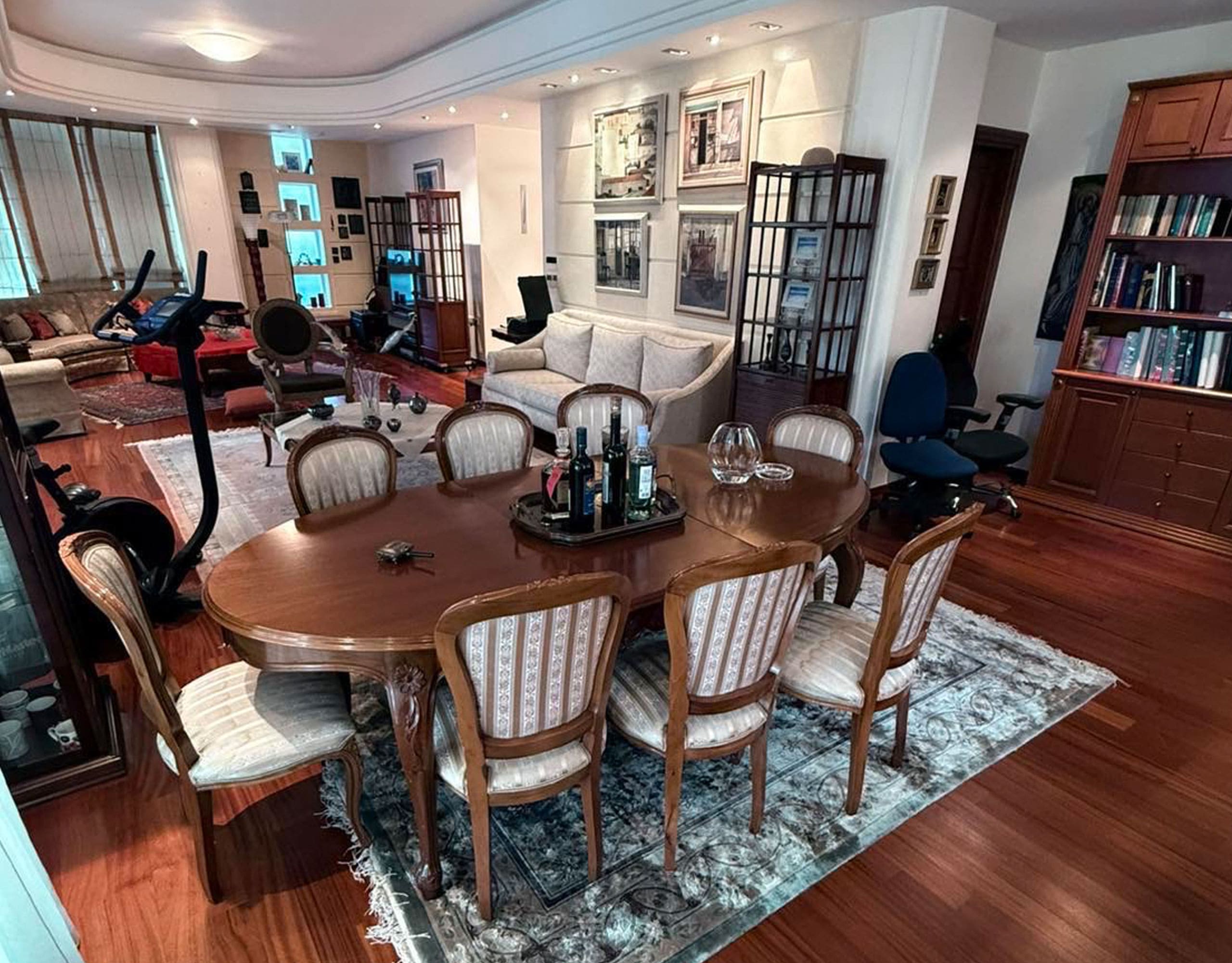 Open-plan living and dining area with wood flooring, dining table, and classic furnishings, Oreokastro, Thessaloniki, Greece