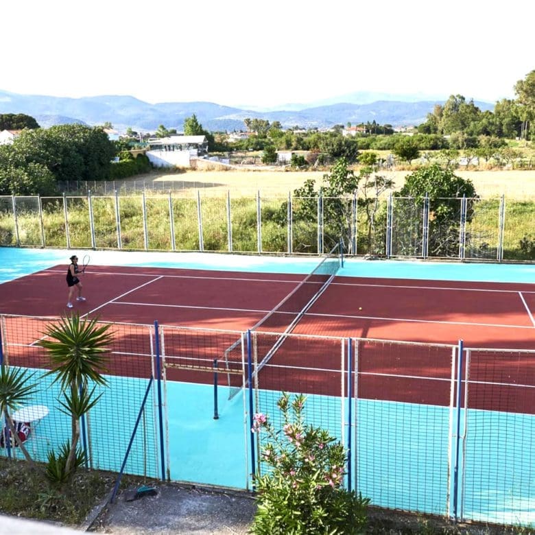 Outdoor tennis court with surrounding greenery and open views, Skala Kallonis, Lesvos, Greece
