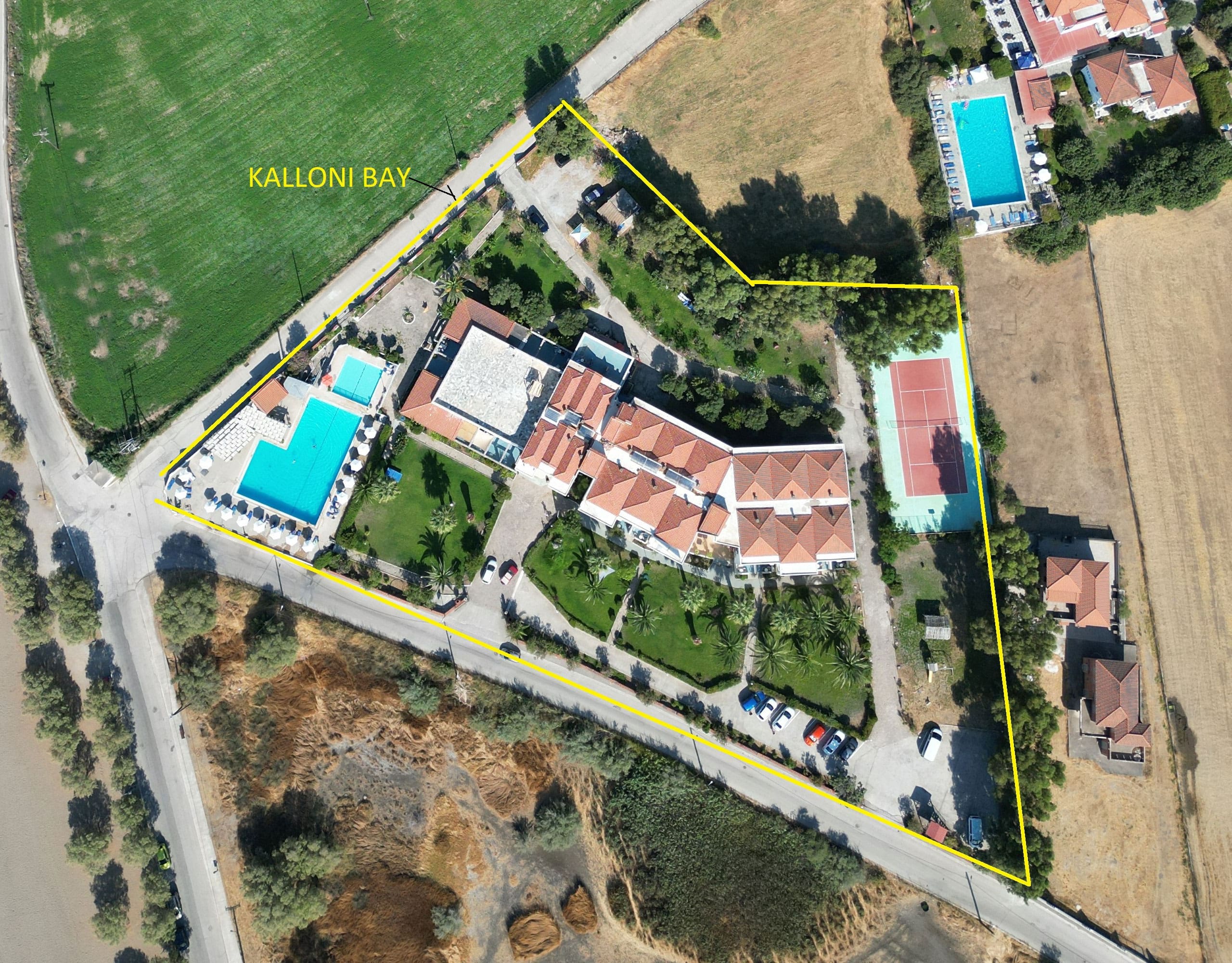 Skala Kallonis 3-Star Beachfront Hotel – Aerial Site Plan View Aerial site plan view of the hotel complex with pool area and surrounding plots, Skala Kallonis, Lesvos, Greece
