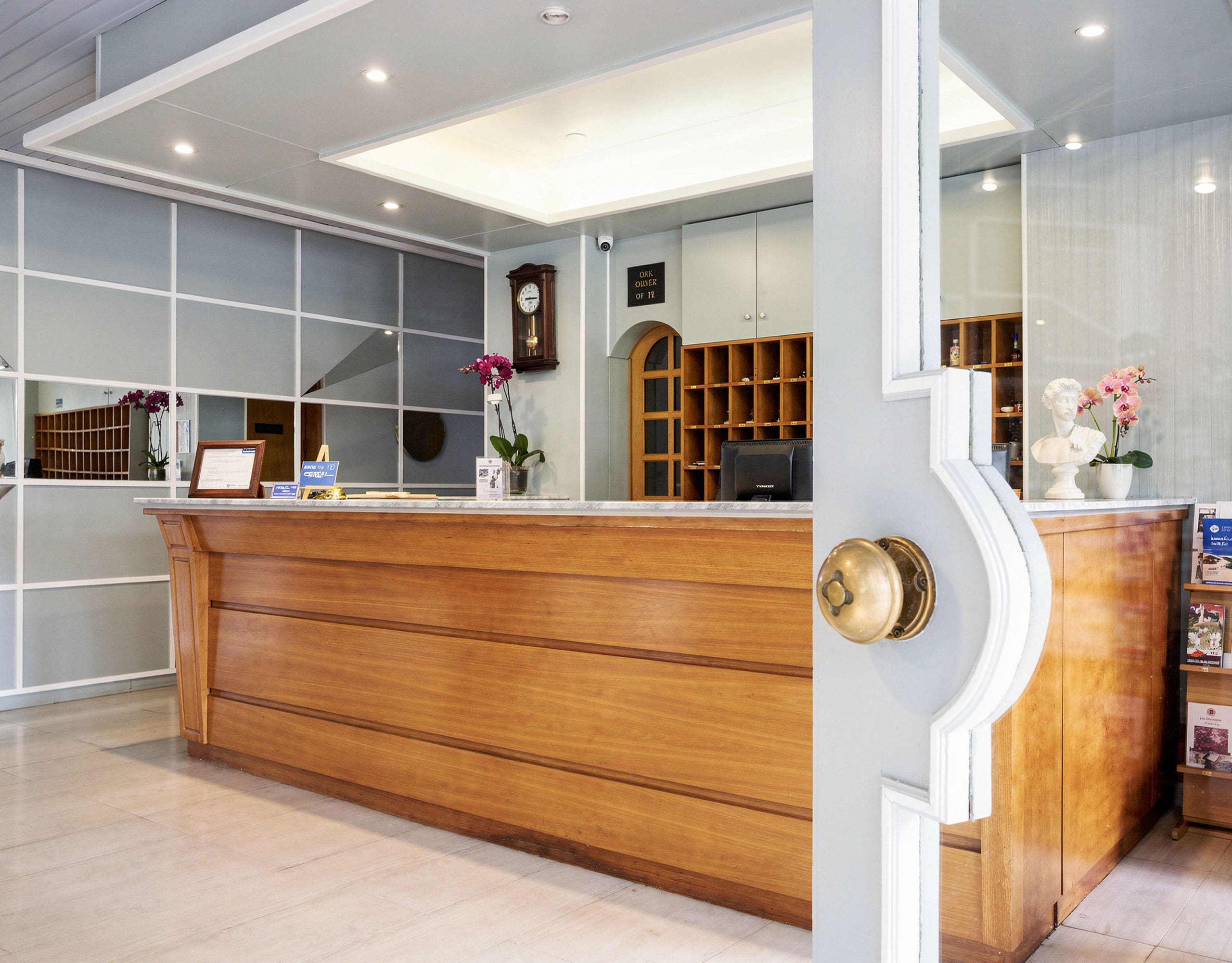Skala Kallonis 3-Star Beachfront Hotel – Reception Area Hotel reception area with wooden front desk and bright interior lighting, Skala Kallonis, Lesvos, Greece