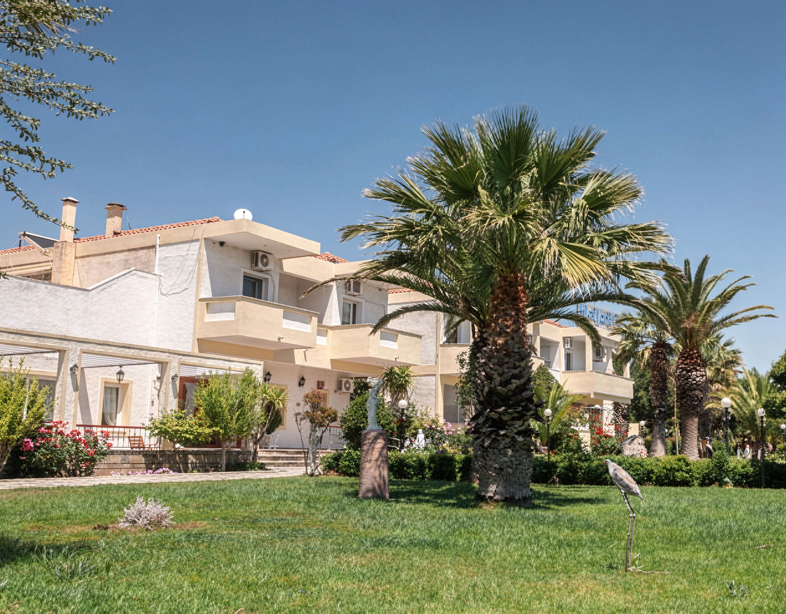 Skala Kallonis 3-Star Beachfront Hotel – Garden And Exterior Hotel garden with palm tree, lawn, and building exterior, Skala Kallonis, Lesvos, Greece