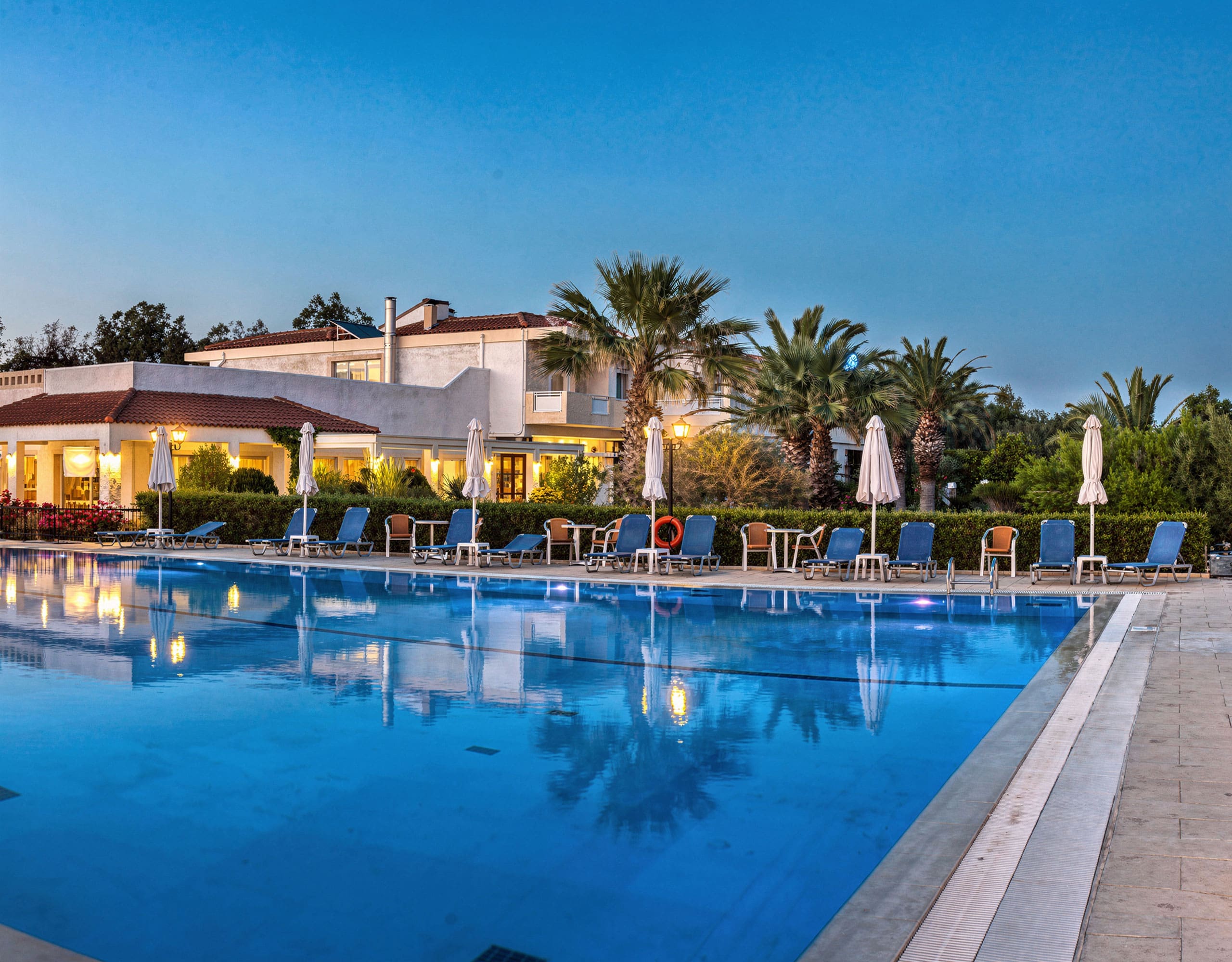 Skala Kallonis 3-Star Beachfront Hotel – Pool At Night Evening view of the hotel swimming pool with lounge seating and lights, Skala Kallonis, Lesvos, Greece
