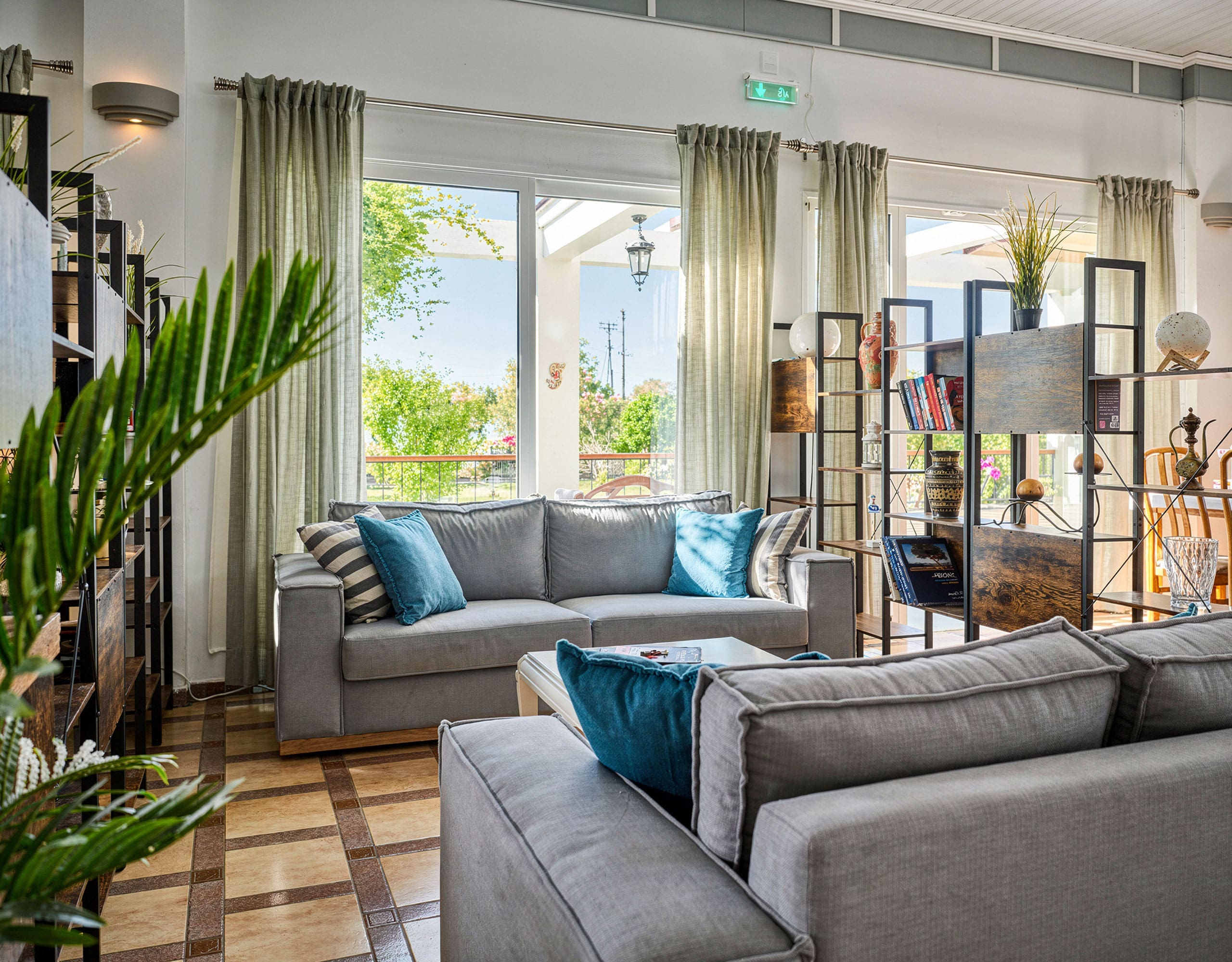 Skala Kallonis 3-Star Beachfront Hotel – Lounge Area Hotel lounge area with sofa seating, indoor plants, and natural light, Skala Kallonis, Lesvos, Greece