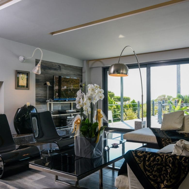 Modern living room with large sliding doors and indoor-outdoor seating, Sounio, Athens Riviera, Greece