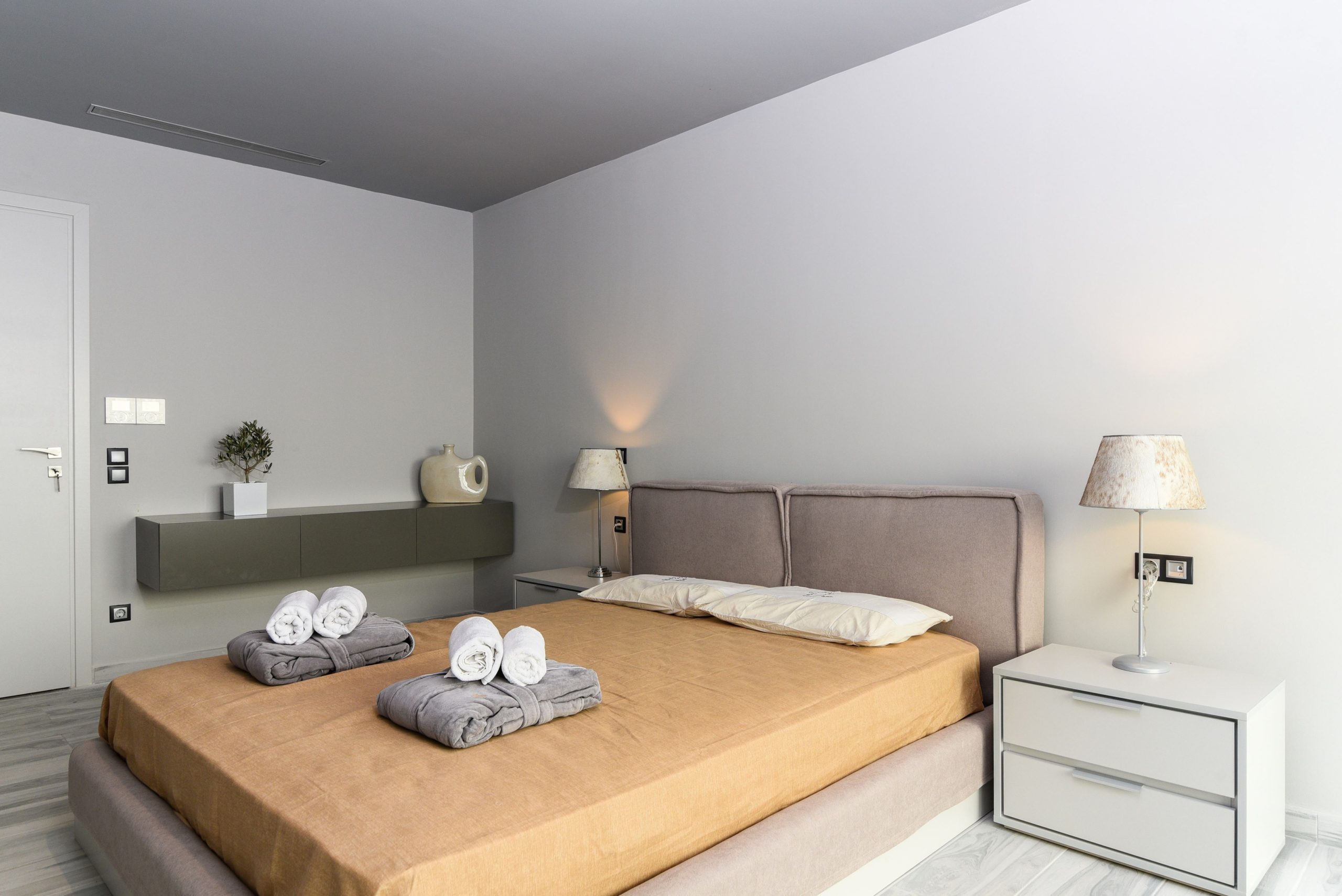 Sounio Beachfront Twin Villas – Bedroom In Neutral Tones Modern bedroom with double bed, bedside tables, and neutral tones, Sounio, Athens Riviera, Greece