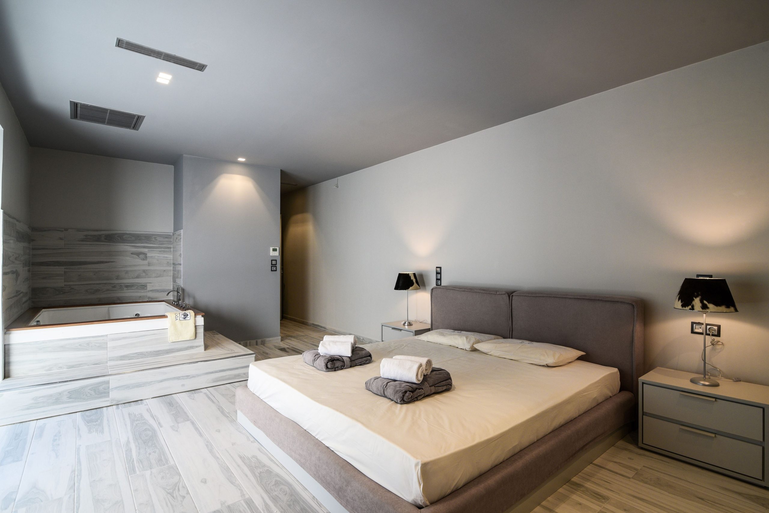 Sounio Beachfront Twin Villas – Spacious Bedroom View Spacious bedroom with double bed and open-plan layout, Sounio, Athens Riviera, Greece