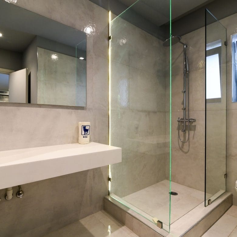 Modern bathroom with vanity, walk-in shower, and window, Sounio, Athens Riviera, Greece