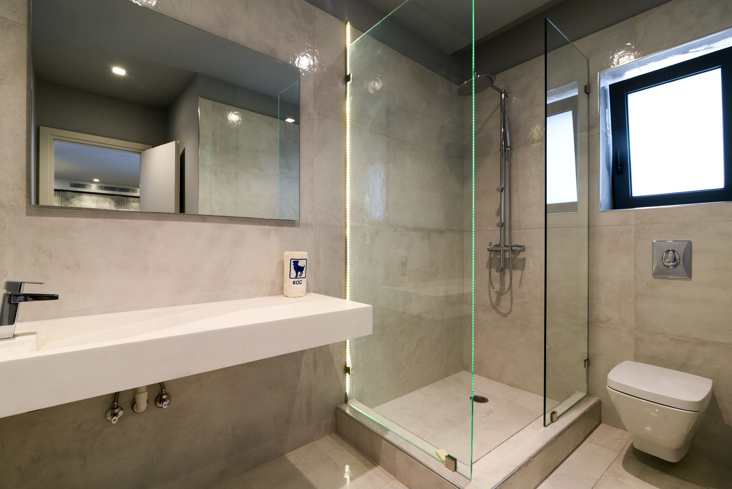 Sounio Beachfront Twin Villas – Bathroom With Walk-In Shower Modern bathroom with vanity, walk-in shower, and window, Sounio, Athens Riviera, Greece