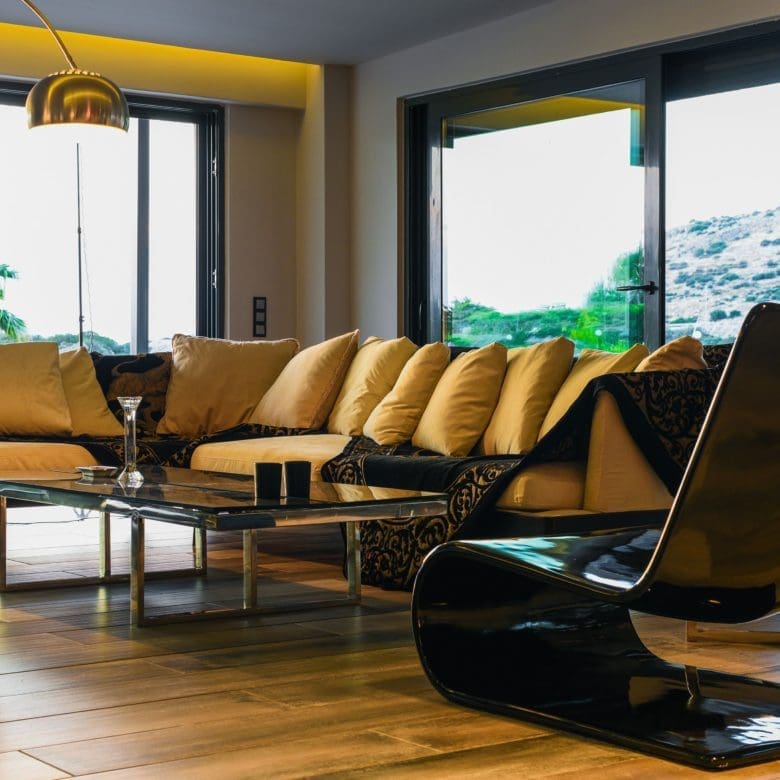 Indoor lounge with modern recliner chairs and large windows, Sounio, Athens Riviera, Greece