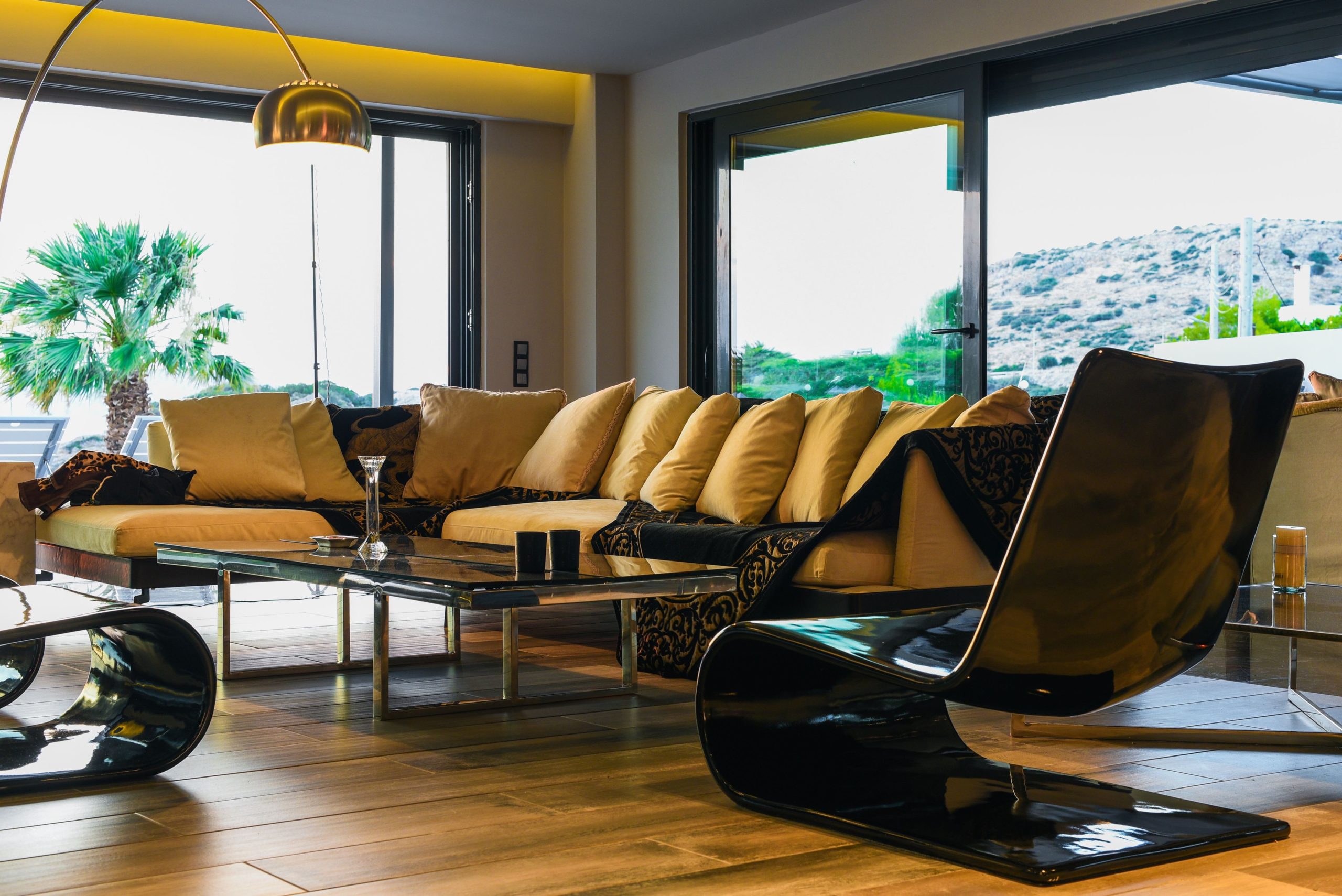 Sounio Beachfront Twin Villas – Lounge With Recliner Chairs Indoor lounge with modern recliner chairs and large windows, Sounio, Athens Riviera, Greece