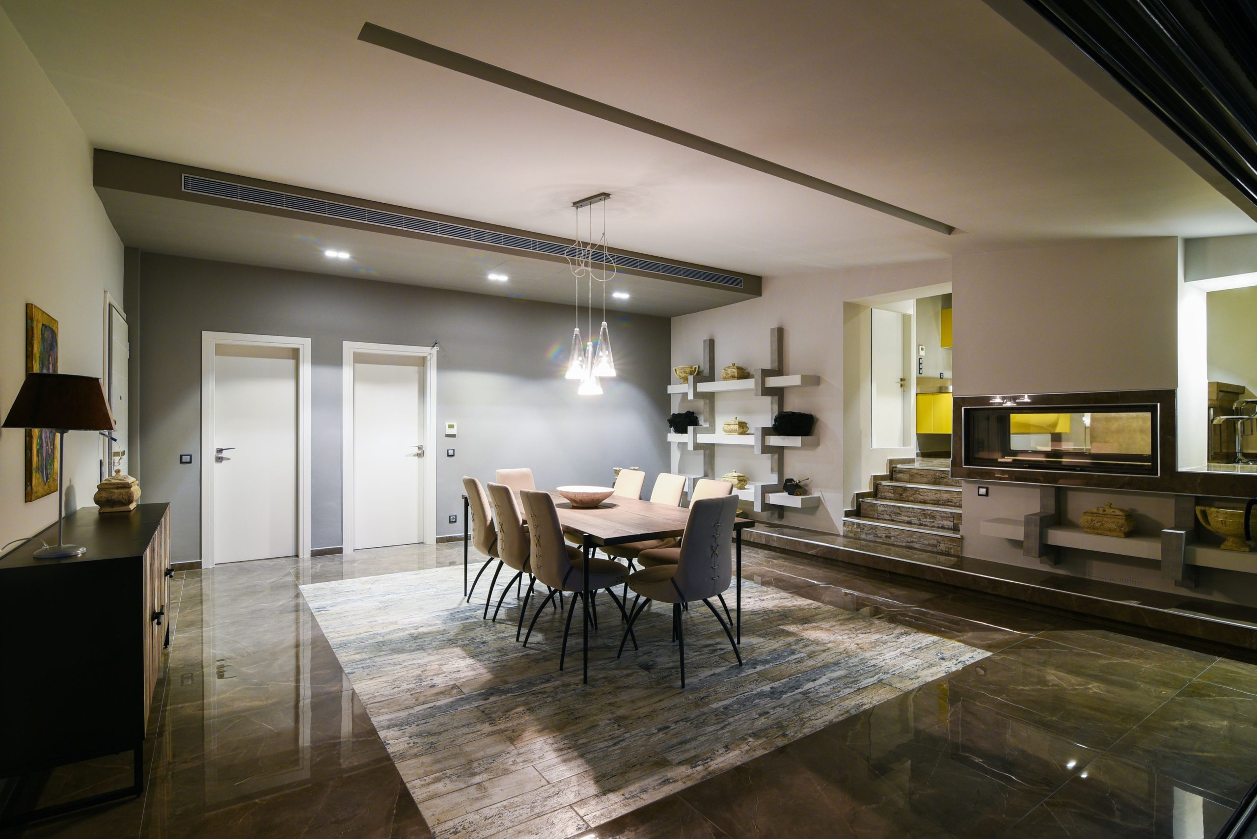 Sounio Beachfront Twin Villas – Dining And Kitchen Area Open-plan dining and kitchen area with modern lighting and bar seating, Sounio, Athens Riviera, Greece