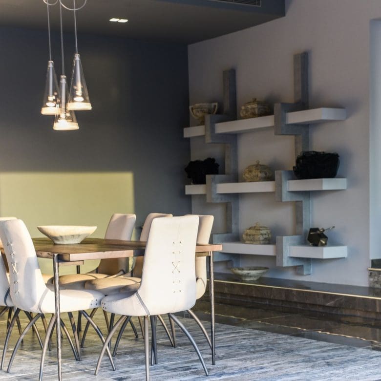 Dining area with white chairs, pendant light, and open-plan living connection, Sounio, Athens Riviera, Greece