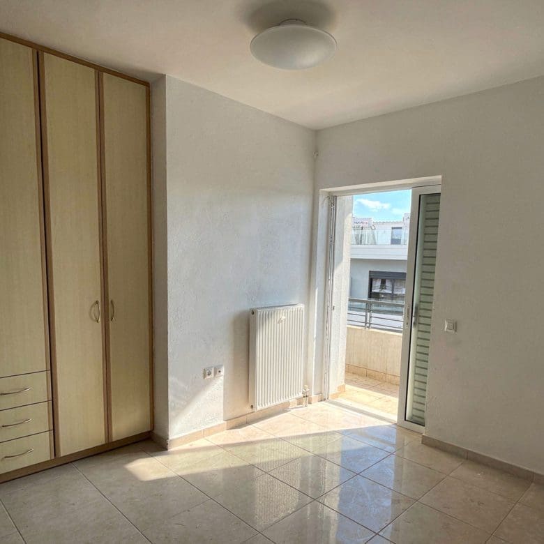 Bedroom with built-in wardrobes and balcony door, Vasiliko, Evia, Greece