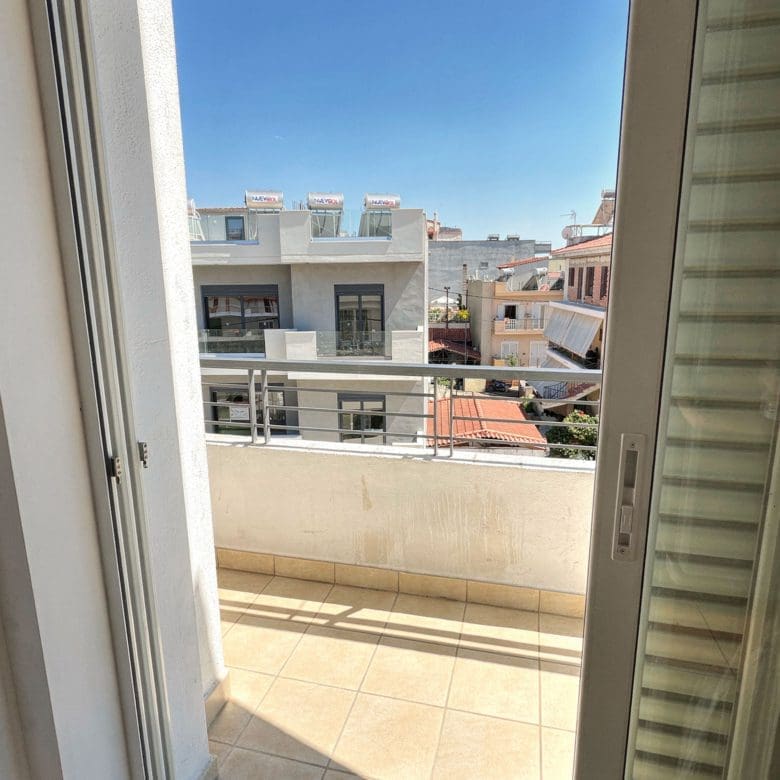 Balcony doorway view with outdoor space and city surroundings, Vasiliko, Evia, Greece