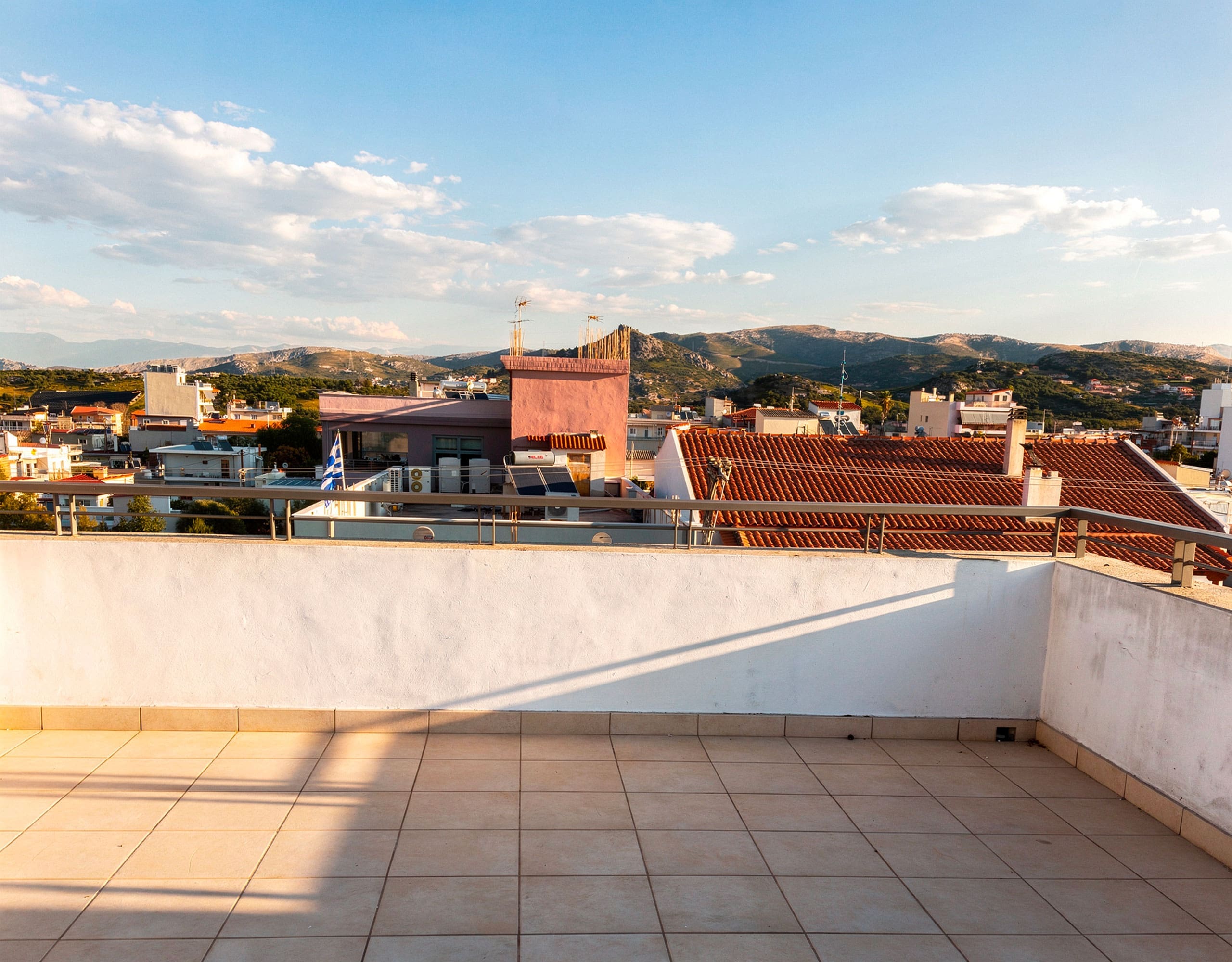 Terrace view over rooftops and the surrounding area in daylight, Vasiliko, Evia, Greece