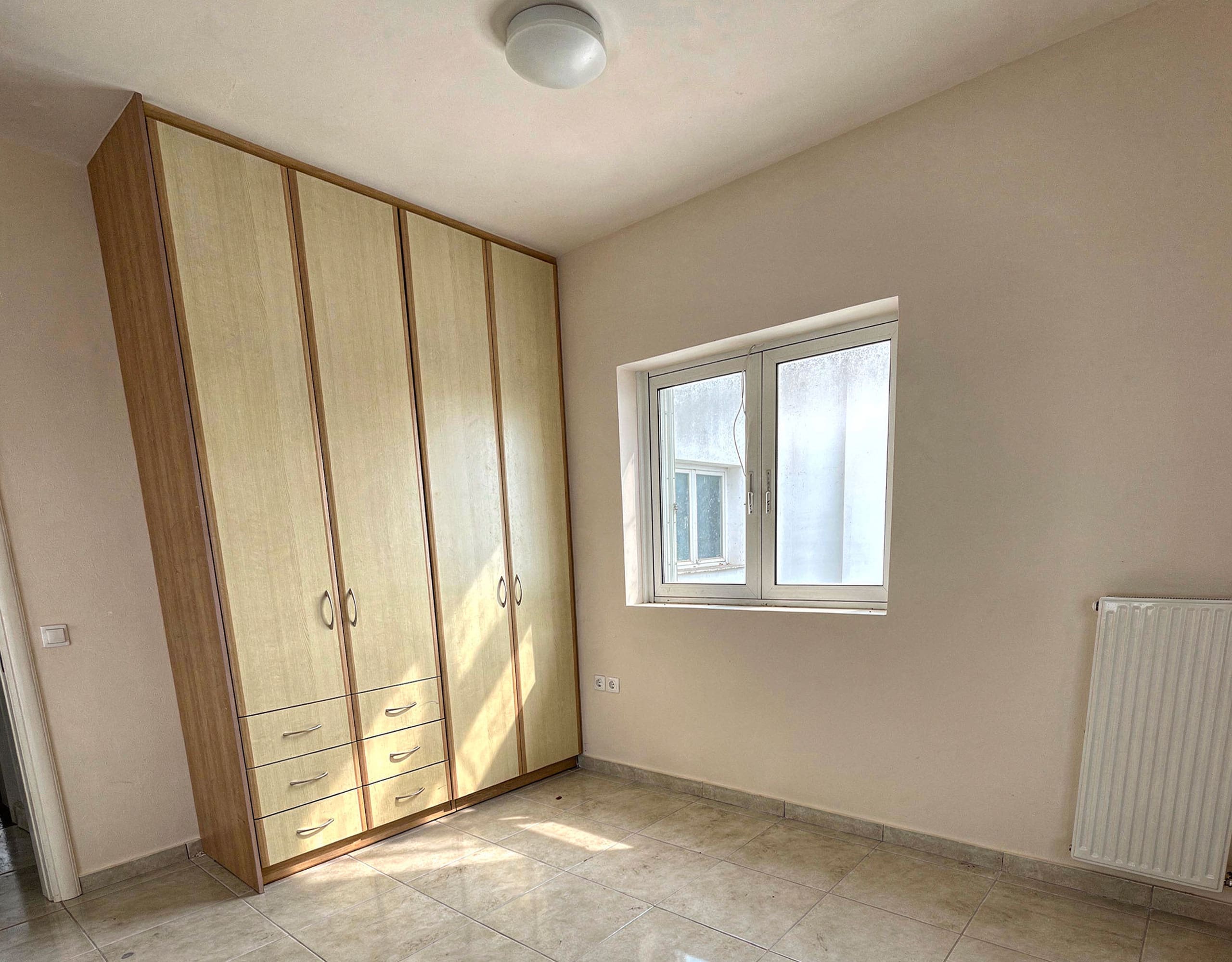 Bedroom with built-in wardrobes and tiled floor, Vasiliko, Evia, Greece