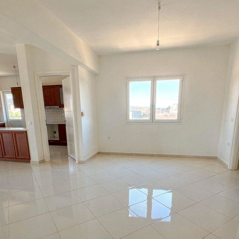 Open-plan interior with tiled floor and kitchen connection, Vasiliko, Evia, Greece