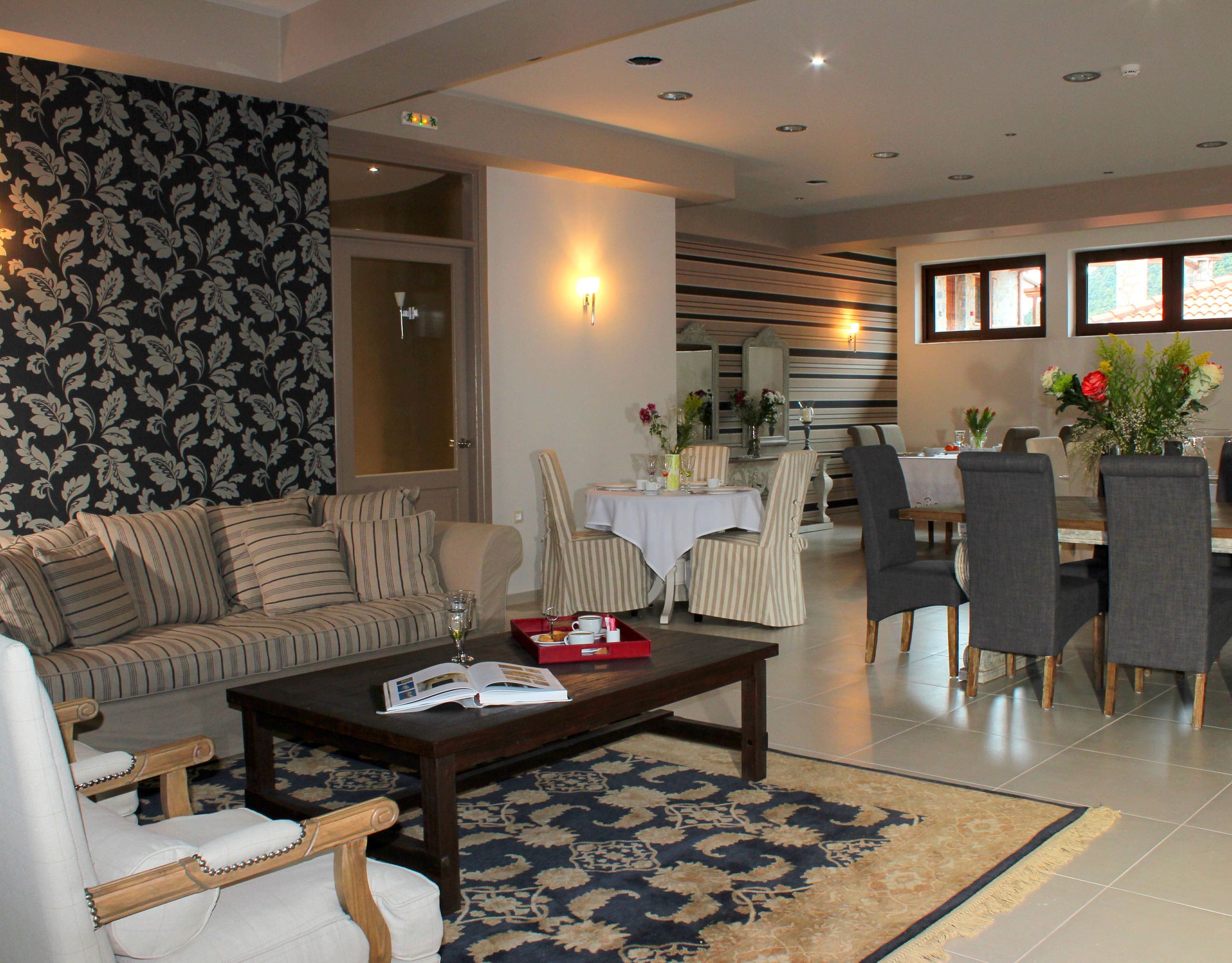 Open-plan lounge and dining area with classic seating and patterned decor, Kardaras, Mount Mainalo, Arcadia, Greece