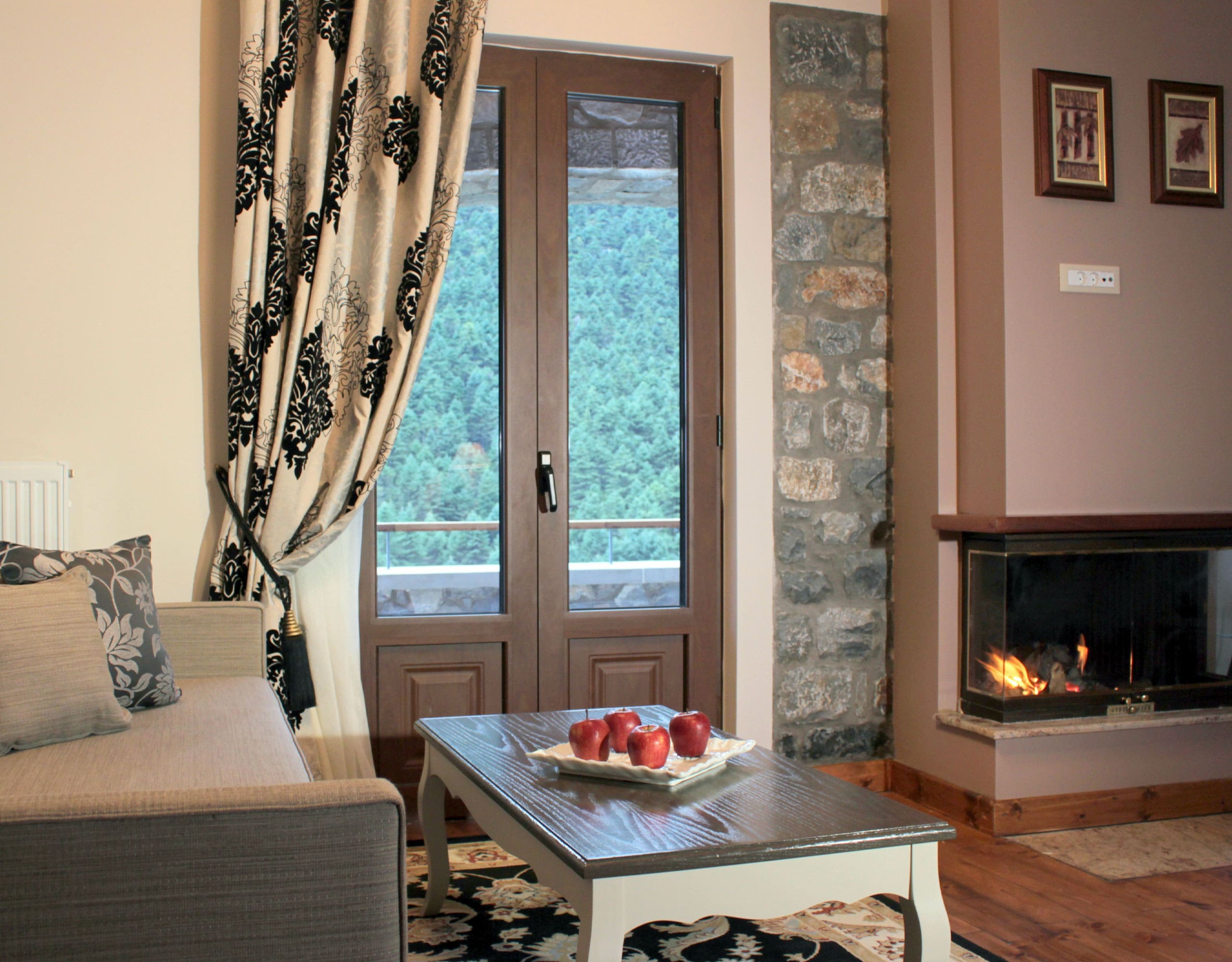 Hotel lounge with classic seating, coffee table, and stone wall detail, Kardaras, Mount Mainalo, Arcadia, Greece