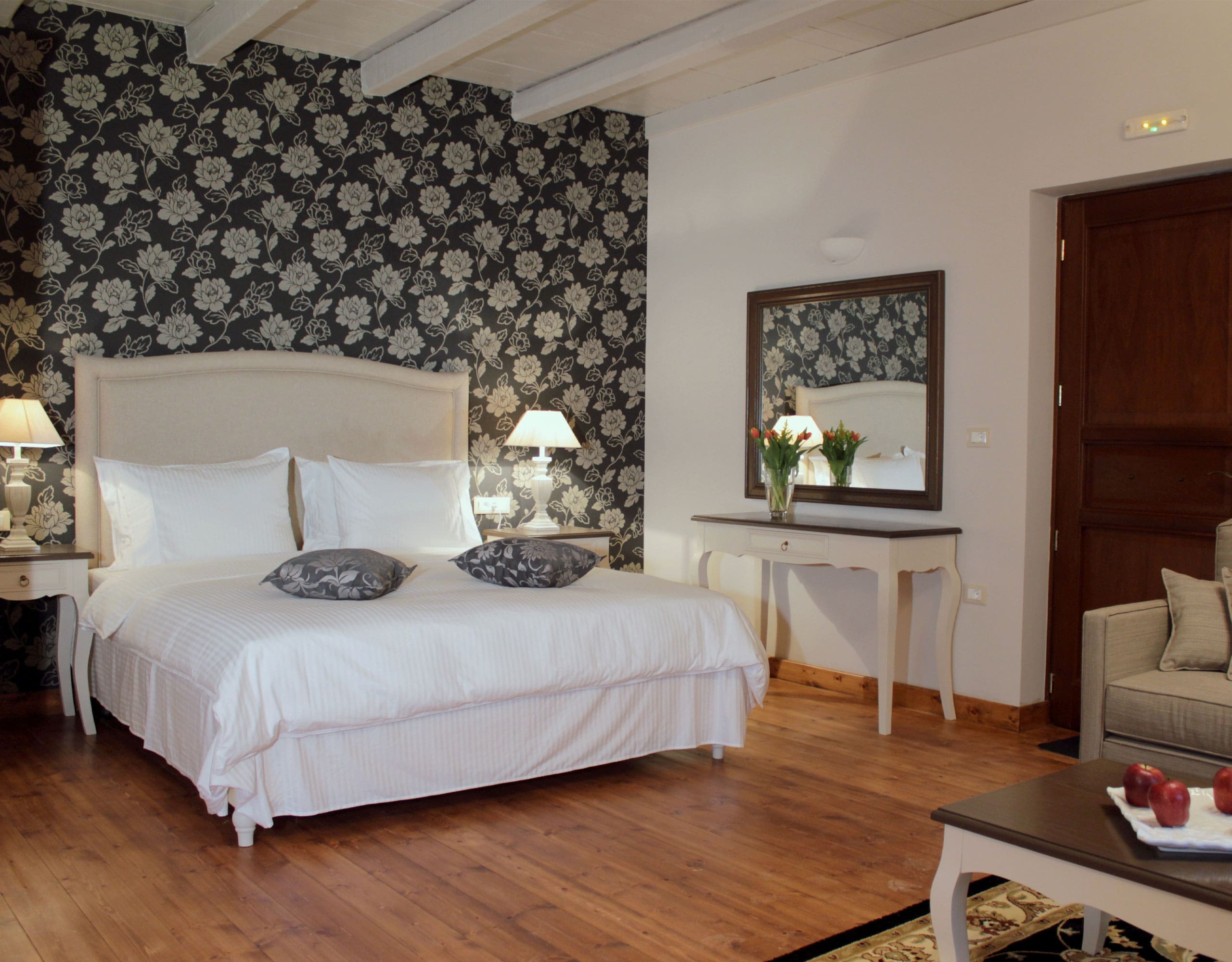 Guest bedroom with double bed, patterned feature wall, and wood flooring, Kardaras, Mount Mainalo, Arcadia, Greece