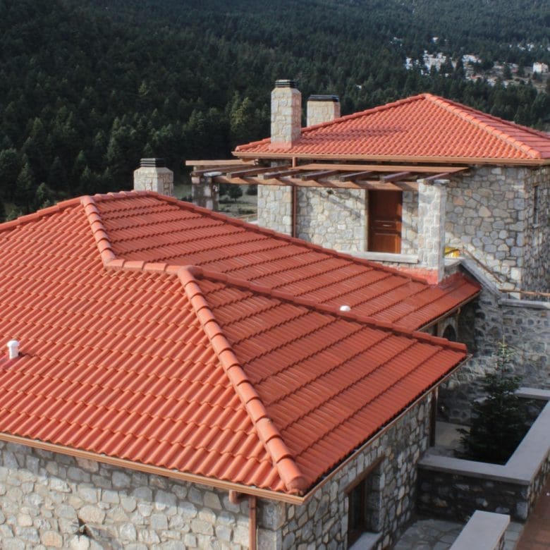 Elevated view over red-tiled rooflines and stone-built volumes, Kardaras, Mount Mainalo, Arcadia, Greece