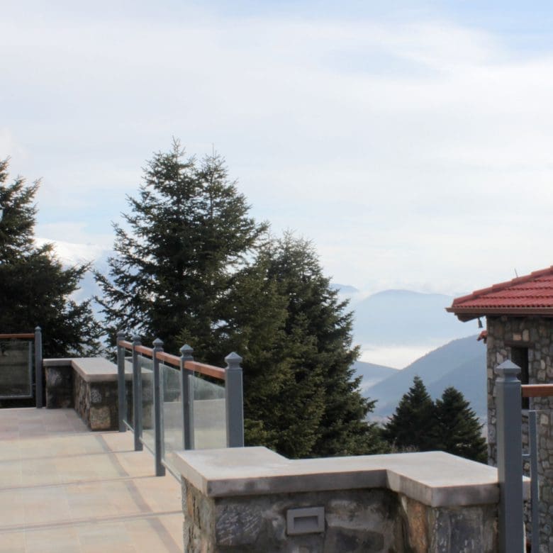 Balcony with stone railing and mountain landscape beyond, Kardaras, Mount Mainalo, Arcadia, Greece