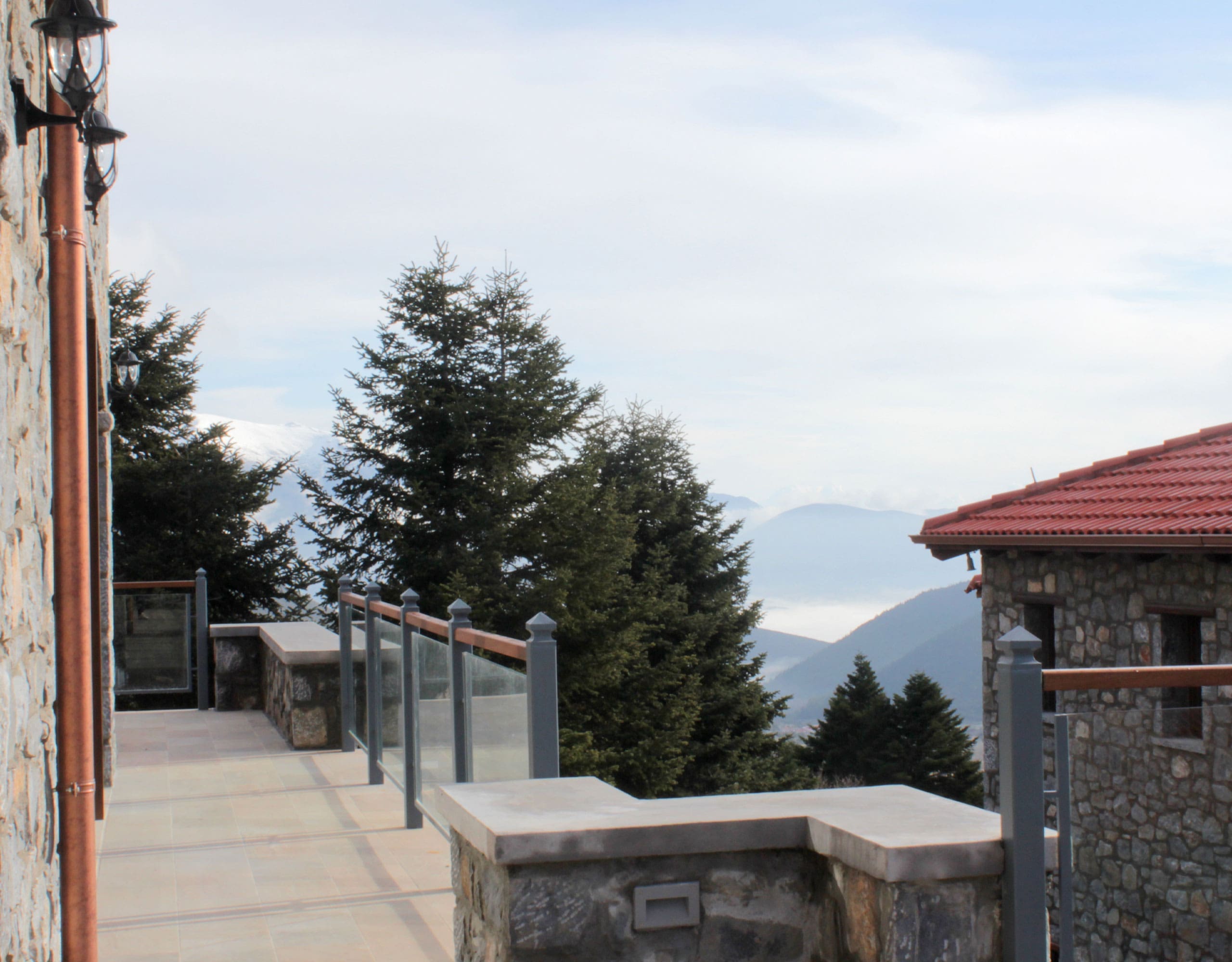 Balcony with stone railing and mountain landscape beyond, Kardaras, Mount Mainalo, Arcadia, Greece