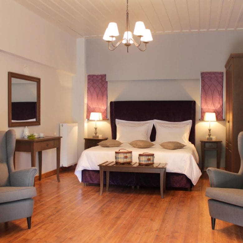 Spacious guest bedroom with double bed, seating area, and soft lighting, Kardaras, Mount Mainalo, Arcadia, Greece