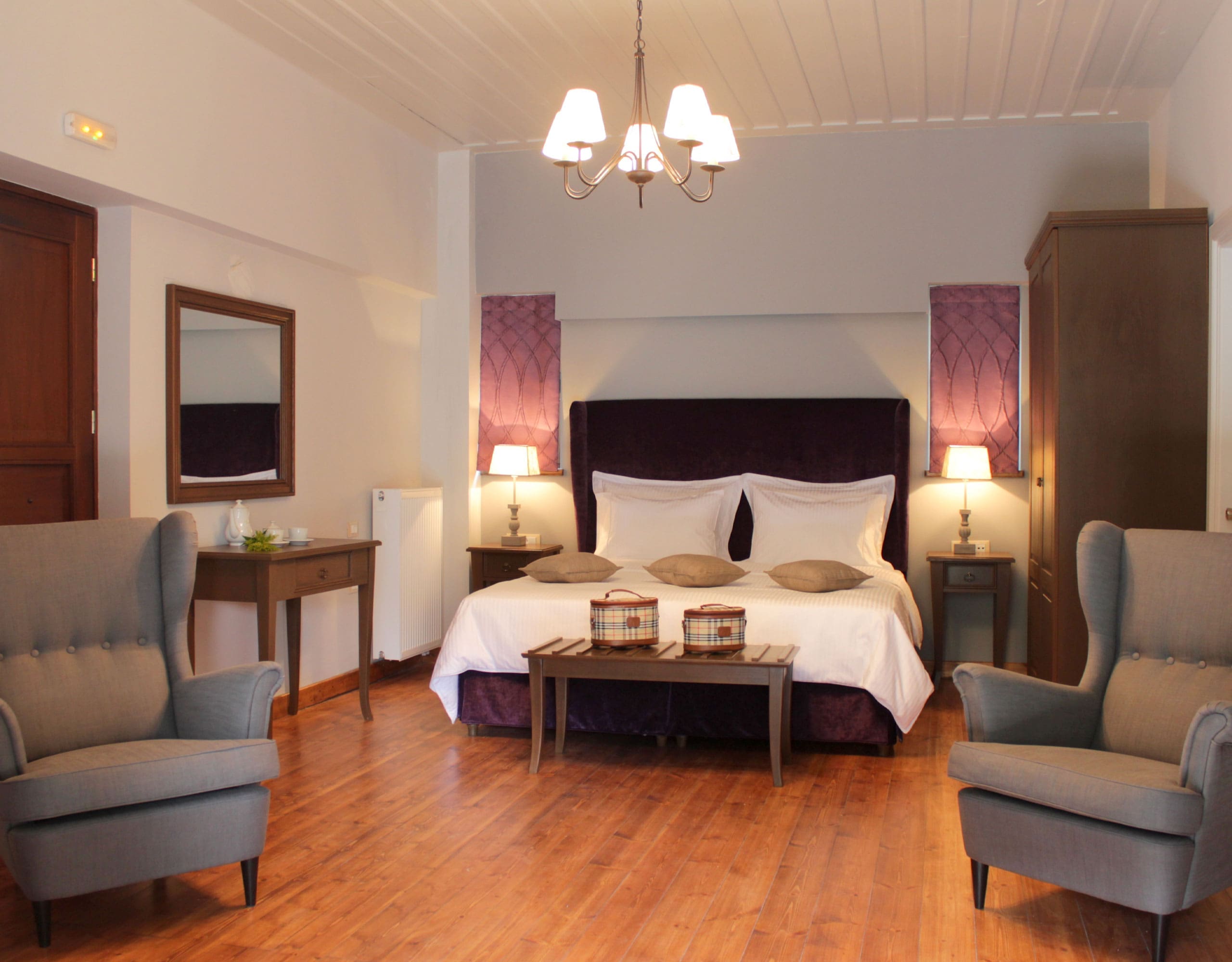 Spacious guest bedroom with double bed, seating area, and soft lighting, Kardaras, Mount Mainalo, Arcadia, Greece