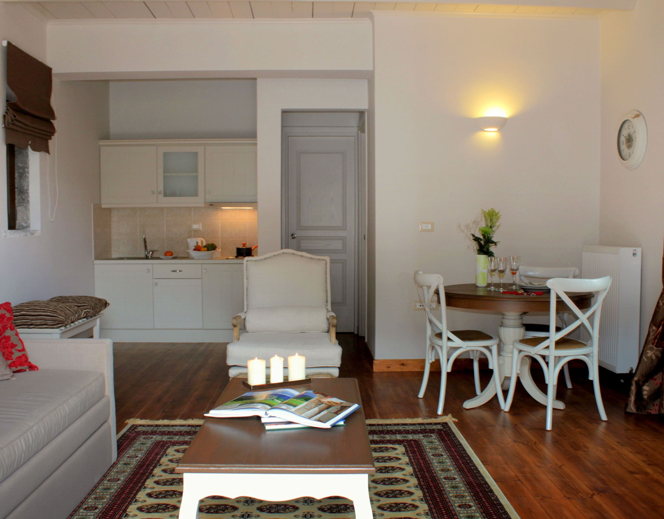 Open-plan suite living area with sofa, dining table, and kitchenette, Kardaras, Mount Mainalo, Arcadia, Greece