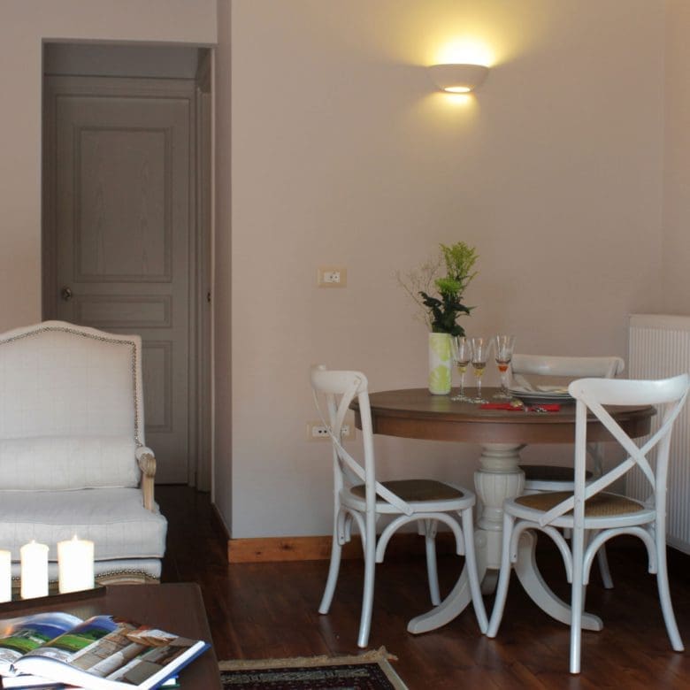Suite interior with bed area, dining table, and kitchenette in an open-plan layout, Kardaras, Mount Mainalo, Arcadia, Greece