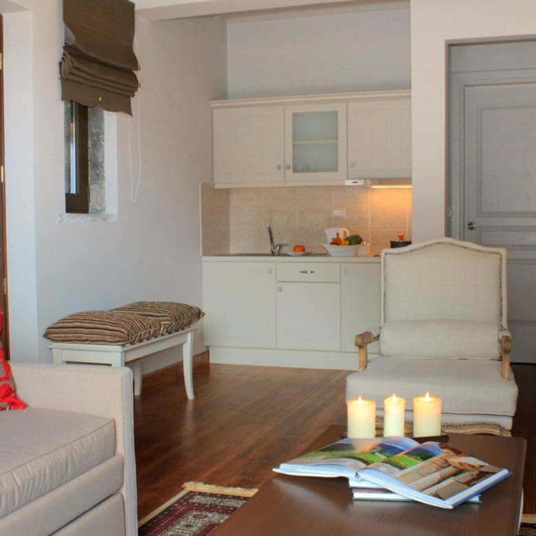 Suite living area with sofa seating, dining table, and compact kitchenette, Kardaras, Mount Mainalo, Arcadia, Greece