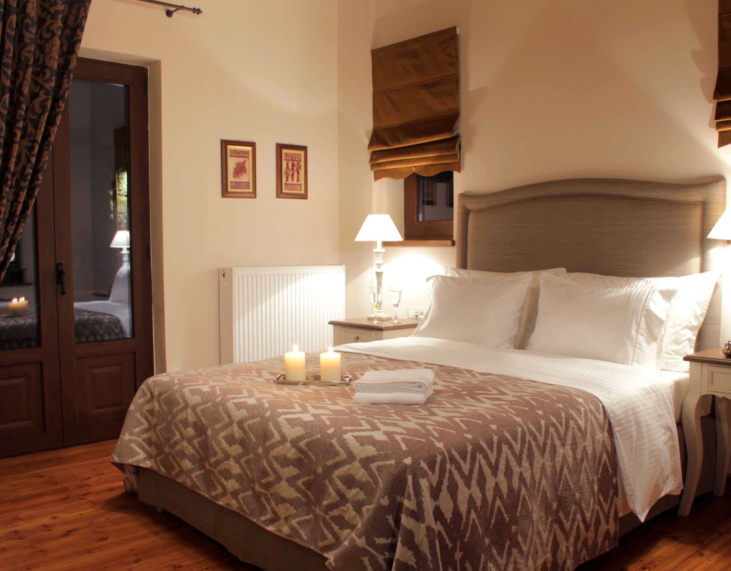 Guest bedroom with double bed, bedside lamps, and warm wood finishes, Kardaras, Mount Mainalo, Arcadia, Greece