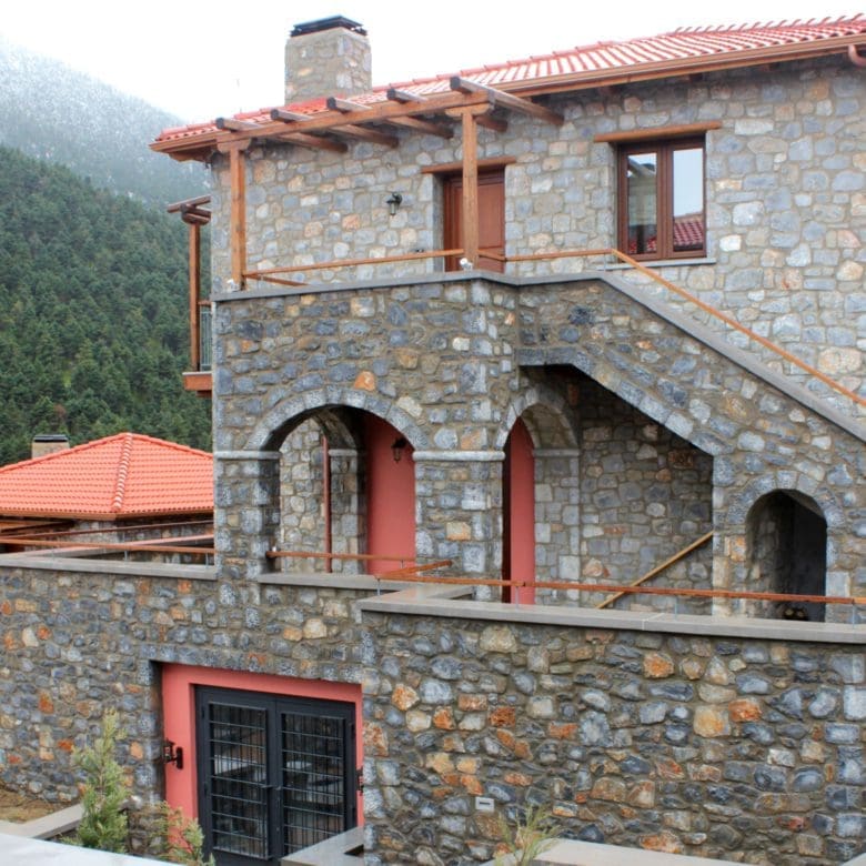 Stone-built hotel exterior with balconies and mountain setting, Kardaras, Mount Mainalo, Arcadia, Greece