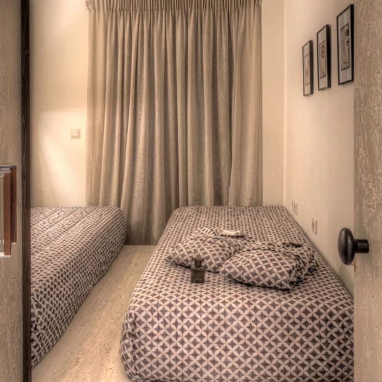 Suite bedroom with double bed, curtains, and textured wall finishes, Pasalimani (Zea Marina), Piraeus, Greece