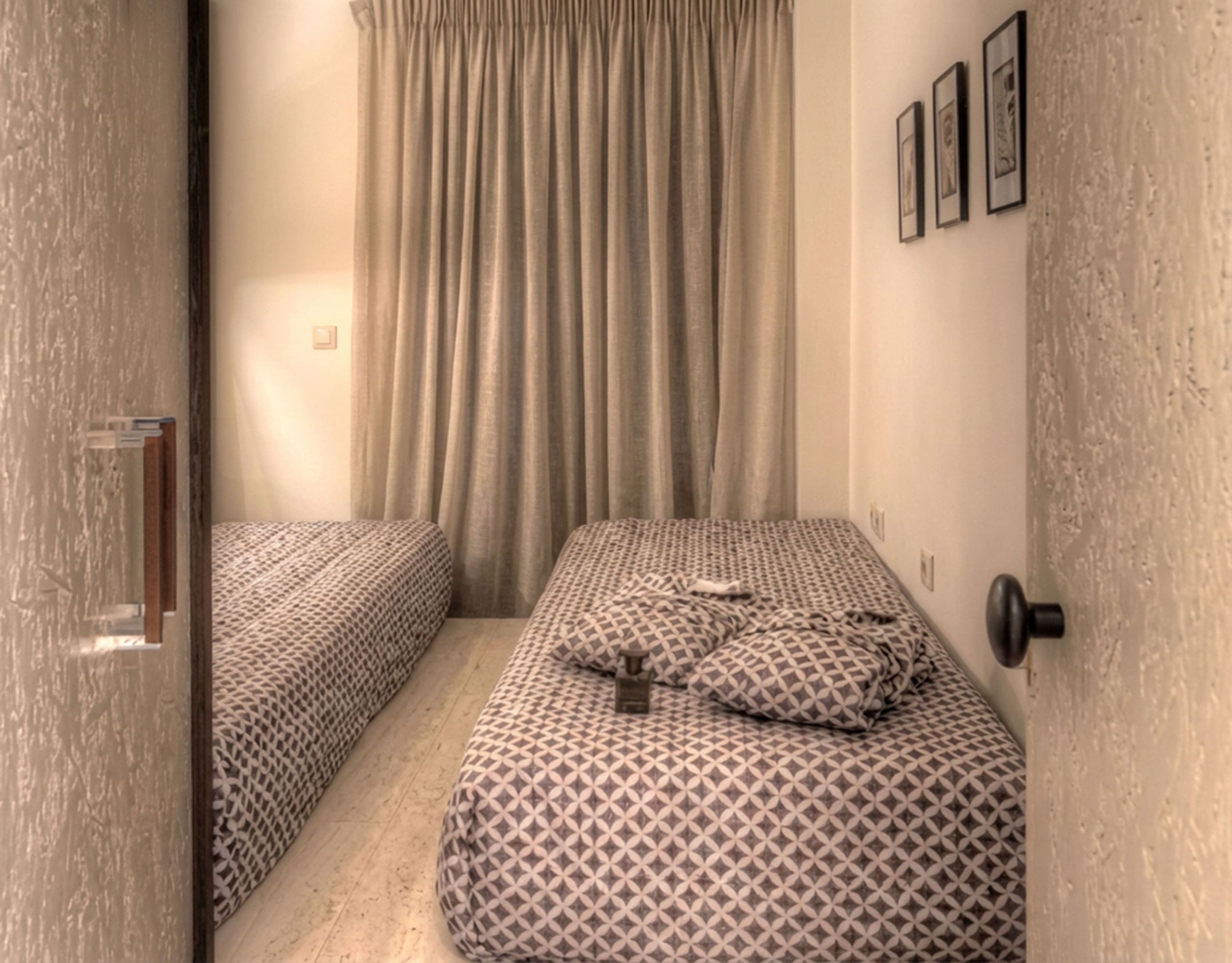 Suite bedroom with double bed, curtains, and textured wall finishes, Pasalimani (Zea Marina), Piraeus, Greece