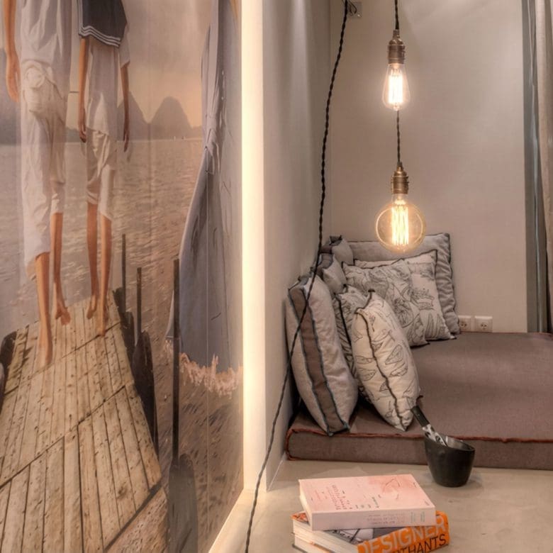 Suite seating nook with pendant light and textured wall, Pasalimani (Zea Marina), Piraeus, Greece
