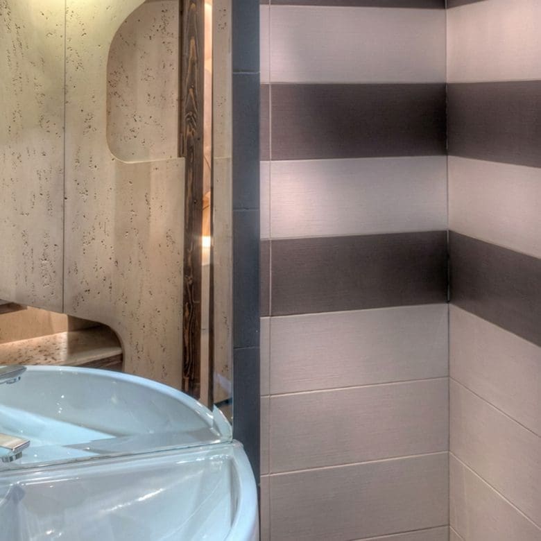 Bathroom detail with round basin sink and striped wall tiles, Pasalimani (Zea Marina), Piraeus, Greece