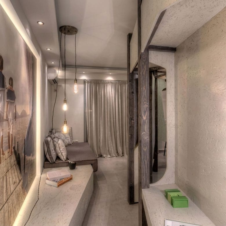 Suite corridor with wall art, pendant lights, and warm ambient lighting, Pasalimani (Zea Marina), Piraeus, Greece