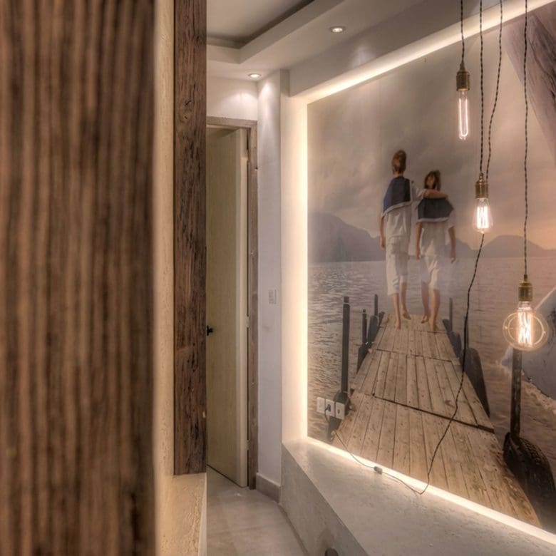 Interior wall detail with illuminated artwork and textured finishes, Pasalimani (Zea Marina), Piraeus, Greece