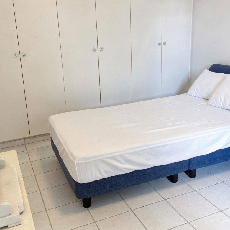 Bedroom with single bed and tiled floor, Voula, Athens Riviera, Greece