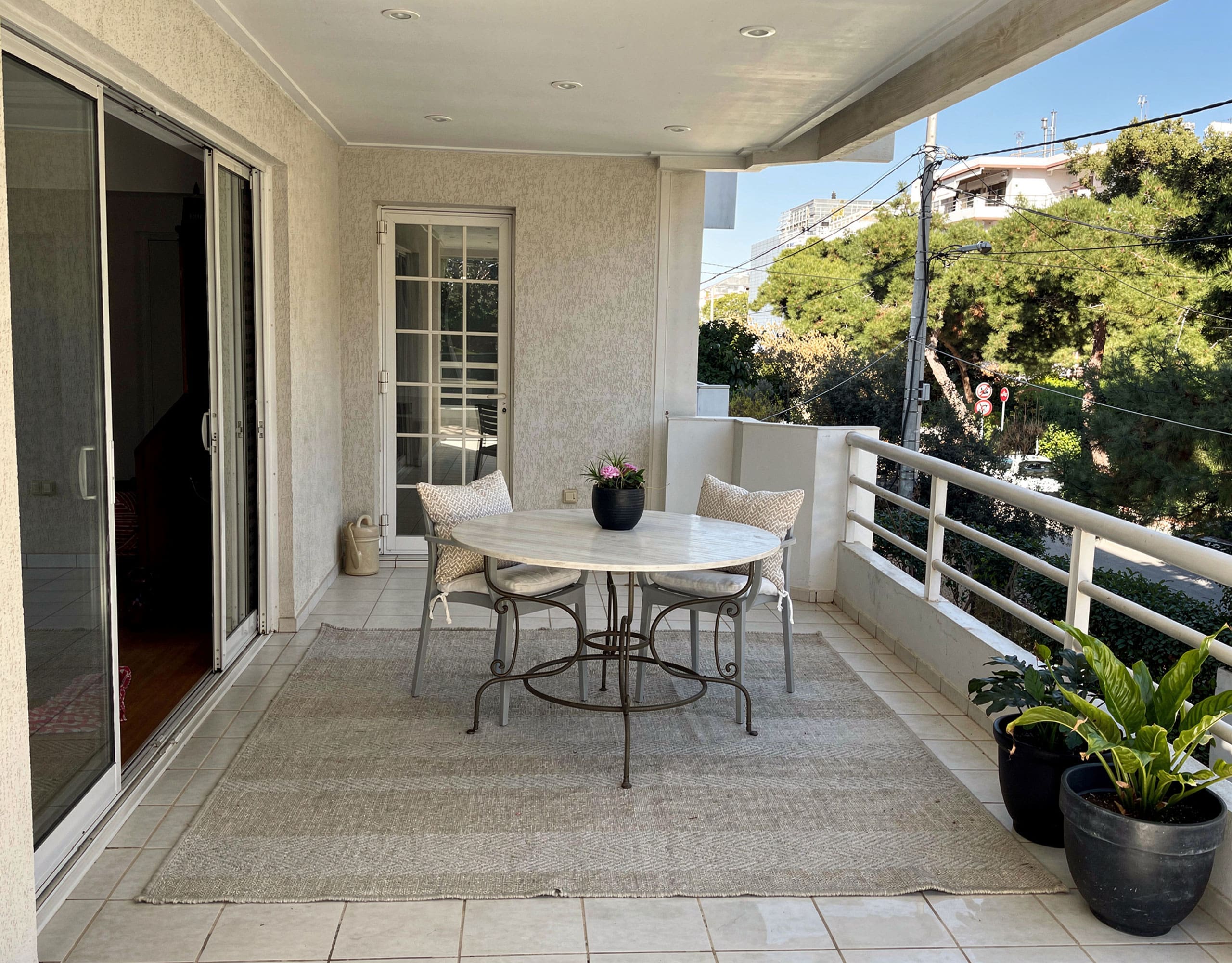 Voula Duplex 181 sqm – Covered Balcony With Seating Covered balcony with outdoor seating and greenery views, Voula, Athens Riviera, Greece