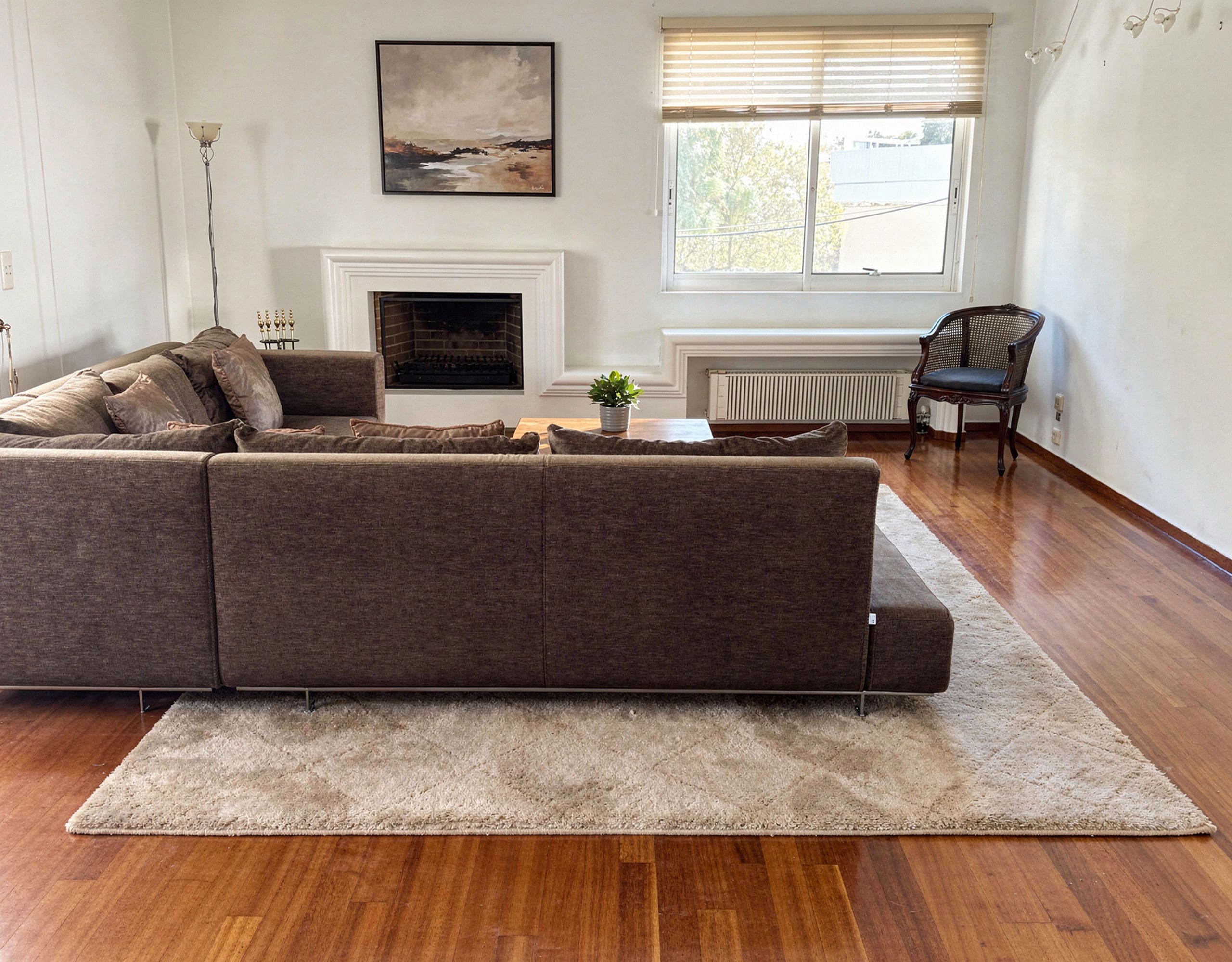 Voula Duplex 181 sqm – Living Room With Fireplace Living room with sofa, fireplace, and wood flooring, Voula, Athens Riviera, Greece