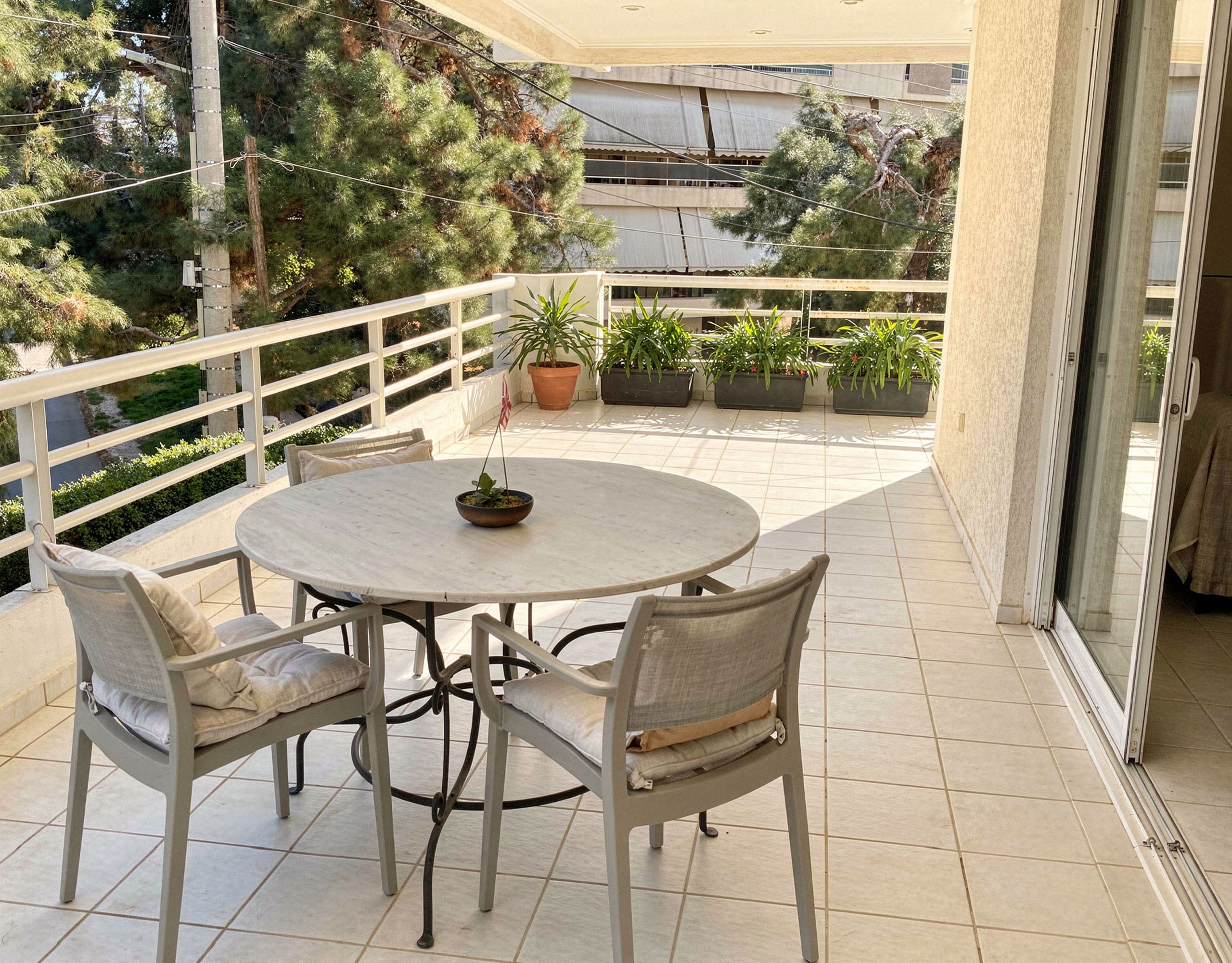 Voula Duplex 181 sqm – Balcony Dining Area Balcony dining area with round table and chairs, Voula, Athens Riviera, Greece