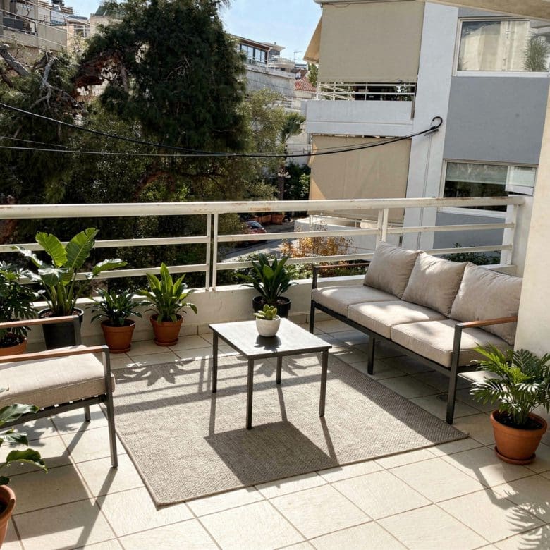 Balcony lounge with outdoor seating and potted plants, Voula, Athens Riviera, Greece
