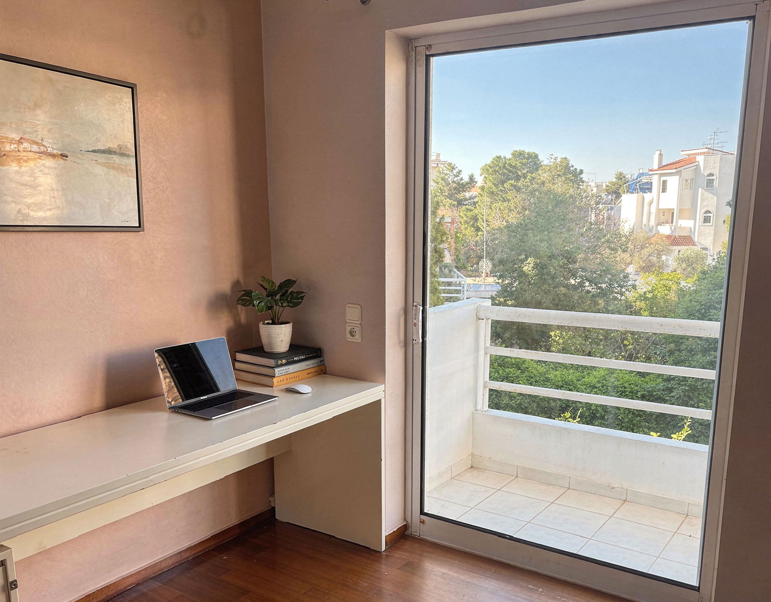 Voula Duplex 181 sqm – Desk Nook With Balcony Access Home office nook with built-in desk and balcony door, Voula, Athens Riviera, Greece