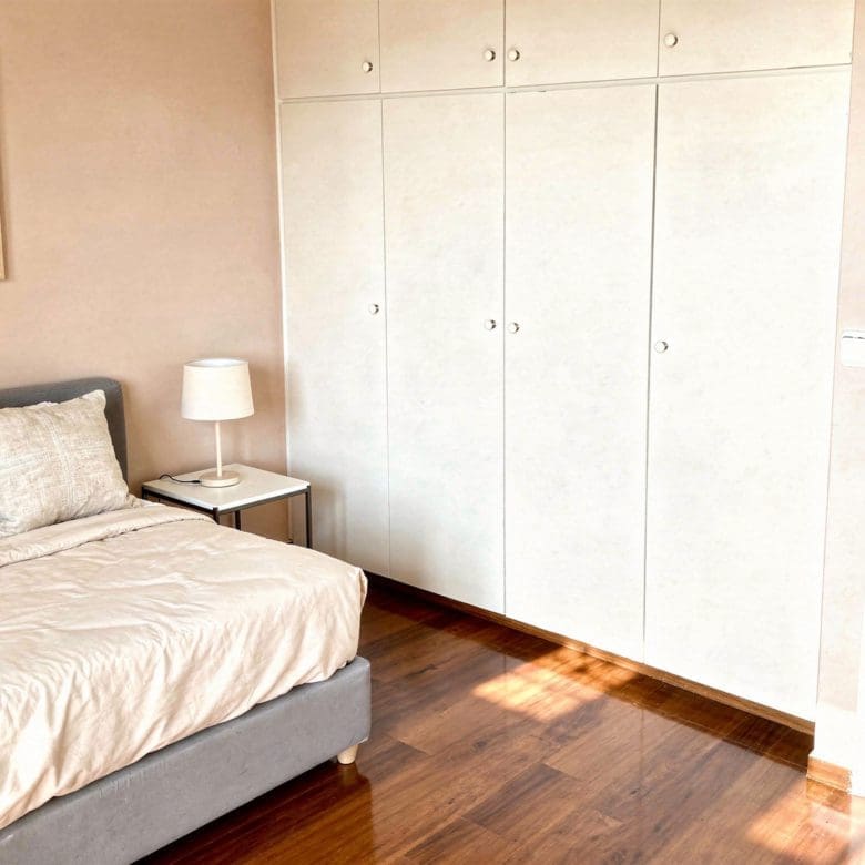Bedroom with double bed, built-in wardrobes, and wood flooring, Voula, Athens Riviera, Greece