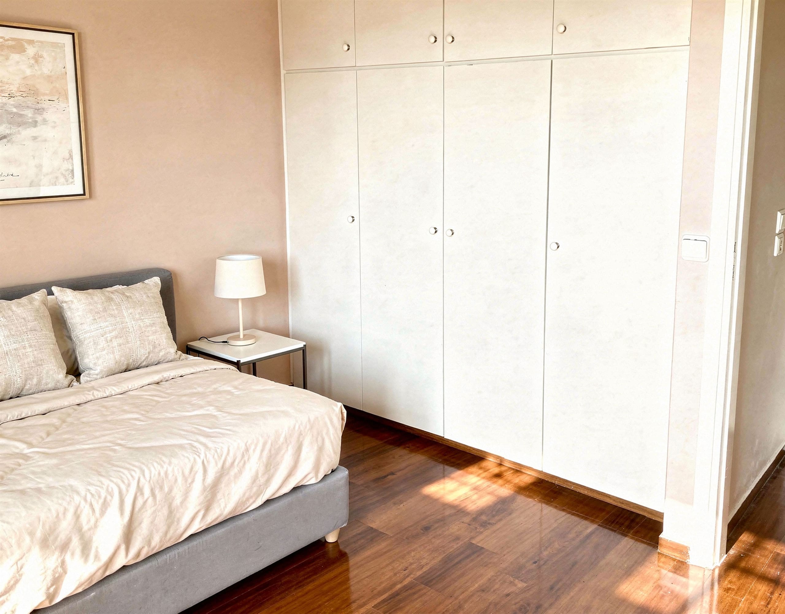 Voula Duplex 181 sqm – Bedroom With Built-In Wardrobes Bedroom with double bed, built-in wardrobes, and wood flooring, Voula, Athens Riviera, Greece